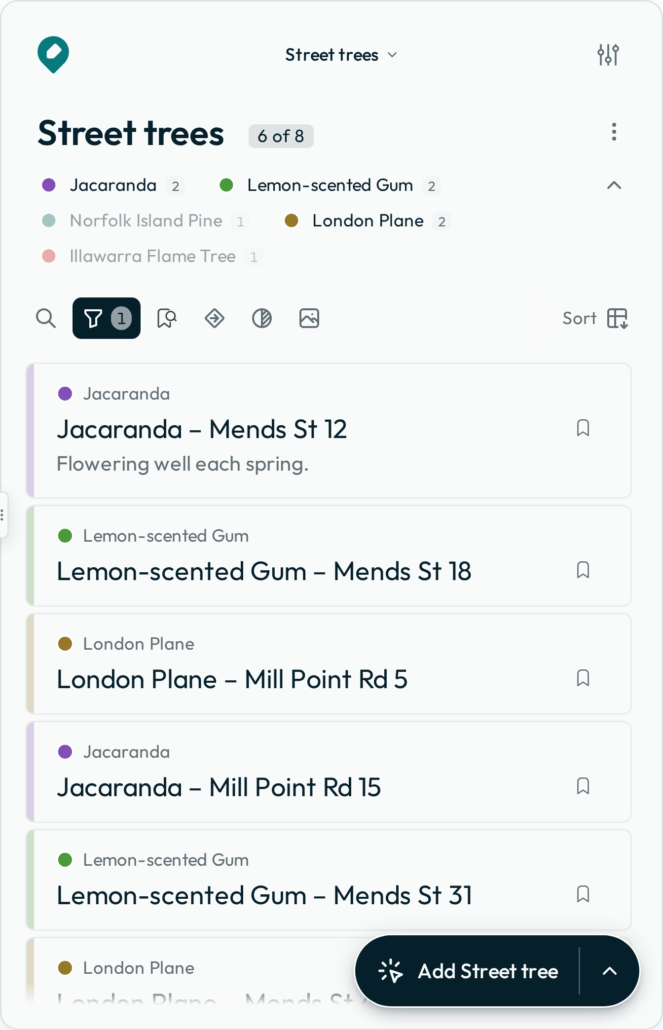 The Data panel of the street-trees map: the species legend above the feature list, with the three species in the filter lit and the two left out dimmed, and the list showing tree titles.